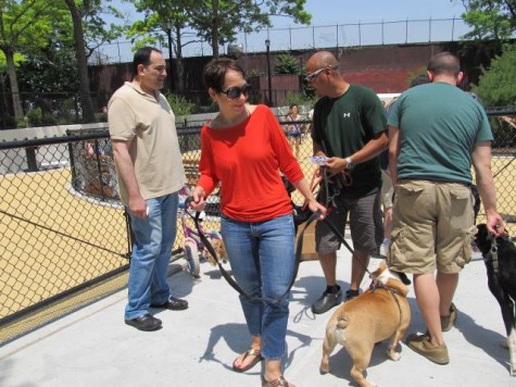 Sam (far left) at the unveiling of a dog run in Sunnyside